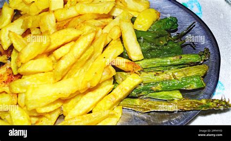 Chicken with baked potatoes Stock Photo - Alamy