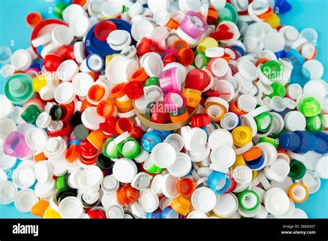 Top view of huge number of plastic bottle caps of different sizes ...