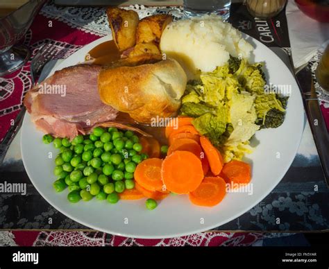 Traditional English Sunday lunch Roast Gammon with Yorkshire Pudding ...