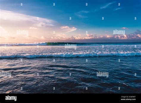 Ocean waves in Bali island with sunset light Stock Photo - Alamy