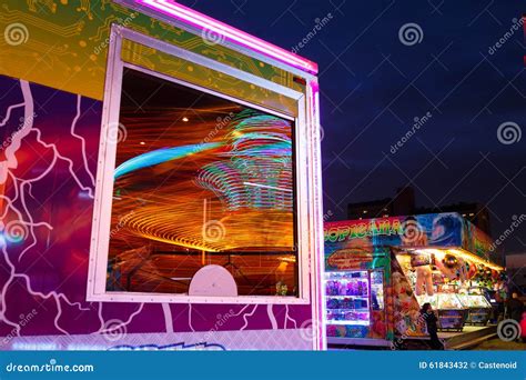 Carousels at night editorial photography. Image of blur - 61843432