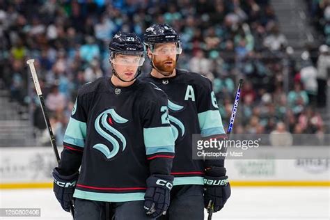 Vince Dunn and Adam Larsson of the Seattle Kraken look on during the ...