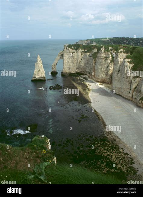 Sea cliff, rock needle and arch, wave cut notch at base of cliffs, wave ...