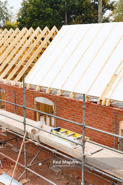 Stock photo - Roof insulation install - Paul Maguire