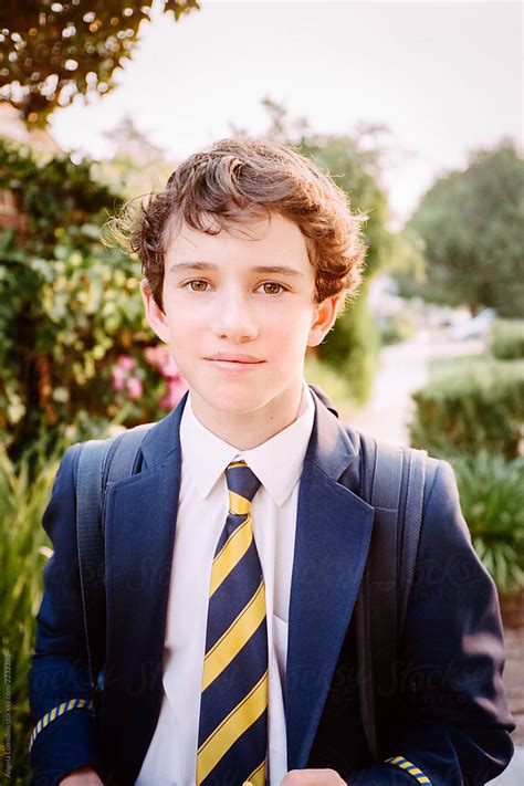 "Teenage Boy In A School Uniform With Backpack" by Stocksy Contributor ...