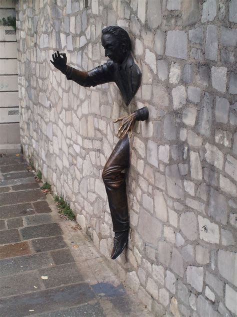 Paris street art. Sculpture is coming out of the wall. | Street art ...