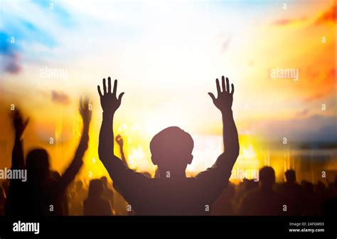 Christian worship with raised hand,music concert Stock Photo - Alamy