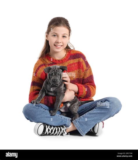 Cute girl with puppy on white background Stock Photo - Alamy