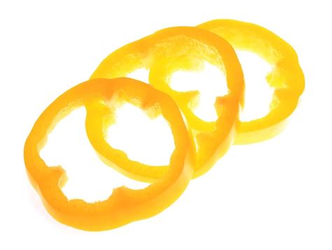 Premium Photo | Fresh yellow pepper slices isolated on white