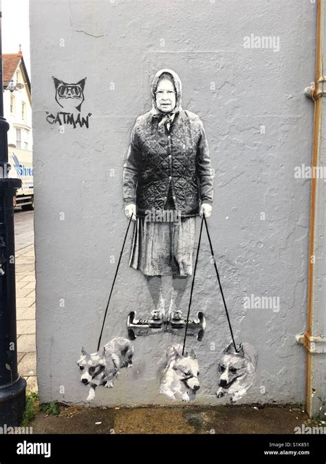 Street art, Queen Elizabeth walking the corgis on a hoverboard Stock ...