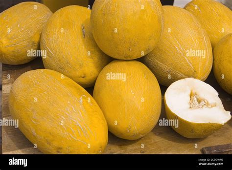 Oval fruits of a ripe and juicy melon with a yello Stock Photo - Alamy