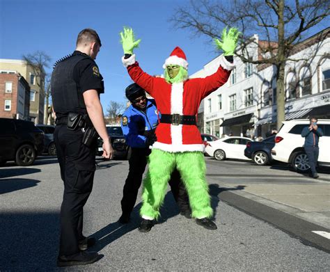 The Grinch 'arrested' on Greenwich Ave. for attempted bike theft