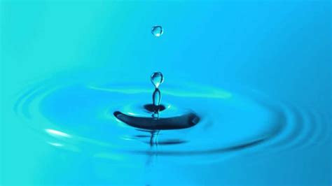 Slow Motion Water Droplet Falling Breaks Surface Tension and Makes ...