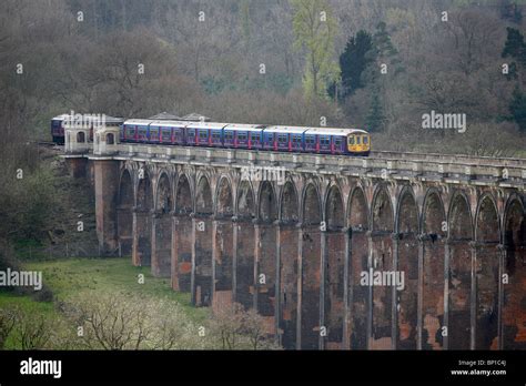 A train crosses the Ouse Valley viaduct near Balcombe Stock Photo - Alamy