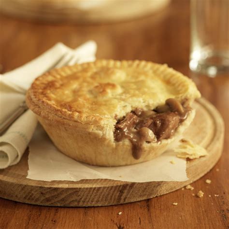 a piece of pie sitting on top of a wooden plate