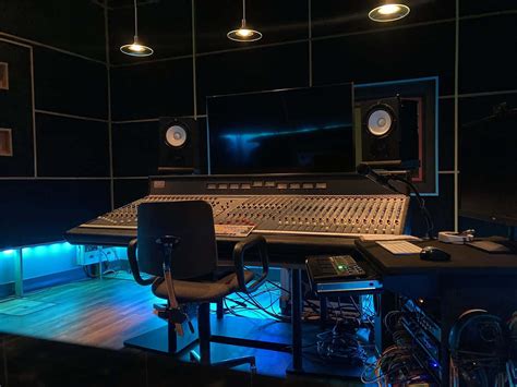 Download A Recording Studio With A Desk And Monitors | Wallpapers.com