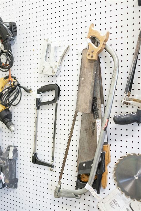 Tools hanging on a pegboard in a garage photo – Free Tools Image on ...