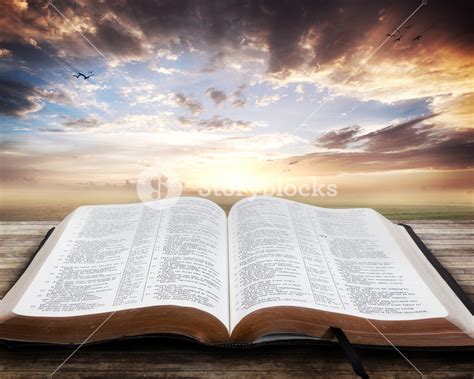 Breathtaking Sunset with Open Bible Royalty-Free Stock Image - Storyblocks