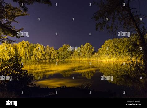 Beautiful Night Reflection on lake, Nightfishing Stock Photo - Alamy