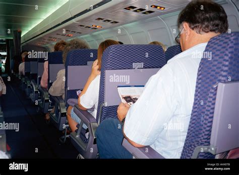 Interior of passenger jet airliner Stock Photo - Alamy