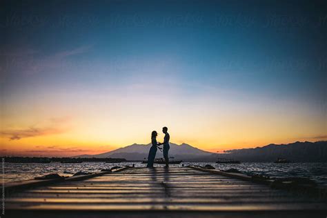 "Couple Holding Hands At Tropical Sunset Beach" by Stocksy Contributor ...