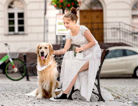 Girl with golden retriever dog | Stock image | Colourbox