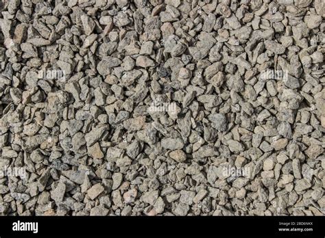 Small gray gravel close up as background Stock Photo - Alamy