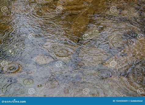 Rain Drops Splashing on the Surface of Water in a Puddle Texture ...