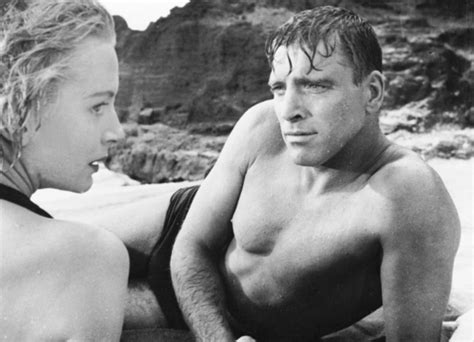 Burt Lancaster and Deborah Kerr get passionate on a beach in the ...