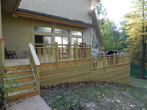 Deck Remodel with multiple levels, a craftsman design railing, and ...