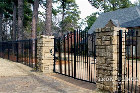 12ft Wide Iron Driveway Gate Mounted on Posts Behind Stone Columns (6 ...