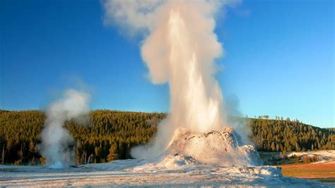 Castle Geyser erupting in early evening in Yellowstone's Upper Geyser ...