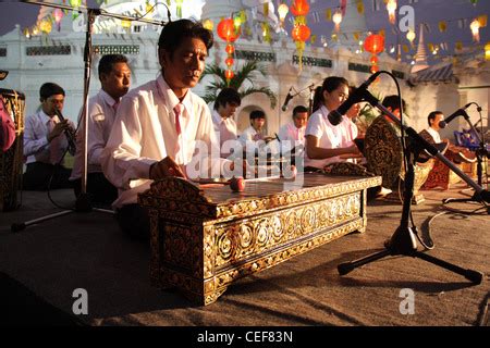 Thai musician performing a Ranat Ek (traditional Thai xylophone Stock ...