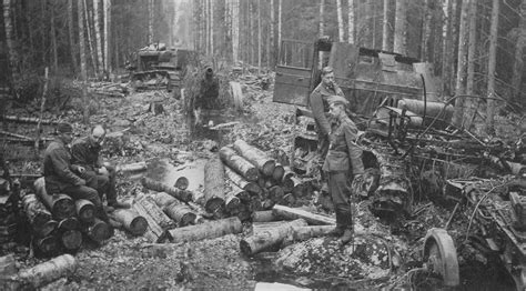 German soldiers amid the wrecks of a convoy of Soviet 152-mm guns ML-20 ...