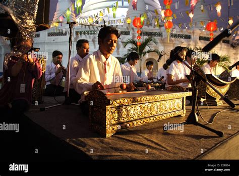 Thai musician performing a Ranat Ek (traditional Thai xylophone Stock ...