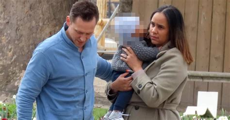 Tom Hiddleston and fiancée Zawe Ashton dote over their baby during ...