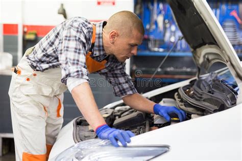 Positive Man Car Mechanician Repairing Car in Auto Repair Service Stock ...