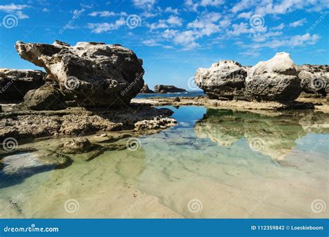 Rock Formation with Reflections in the Sea at Peterborough Beach ...