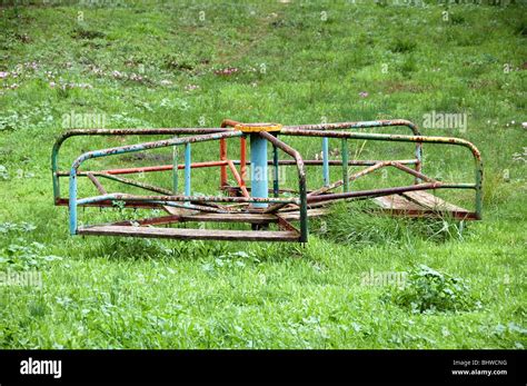 Vintage rusty merry-go-round. Abandoned playground Stock Photo - Alamy