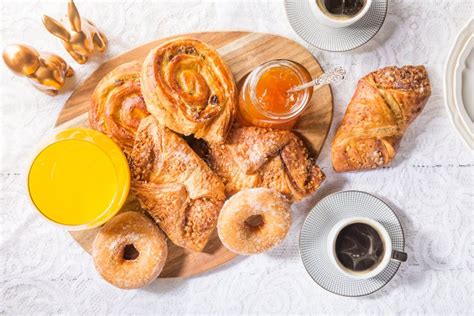 Breakfast with Different French Pastries, Juice and Jam Stock Photo ...