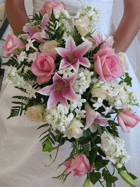 Traditional cascading bouquet of pink stargazer lily, pink sofie rose ...