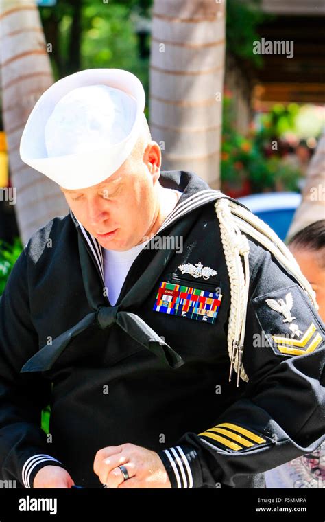 US Navy Petty Officer Second Class in his dress uniform at the Memorial ...