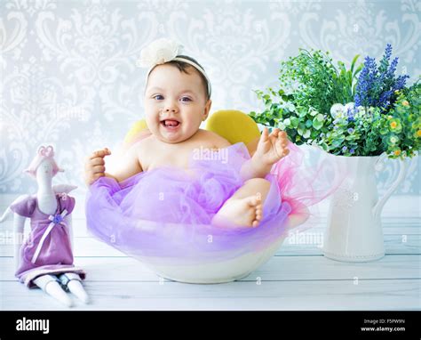 Cute baby playing in the colorful room Stock Photo - Alamy