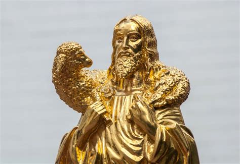 Golden Statue of Jesus Christ with Lamb on His Shoulders Stock Image ...