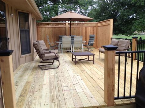 Pressure treated decking with cedar posts and privacy panels. Westbury ...