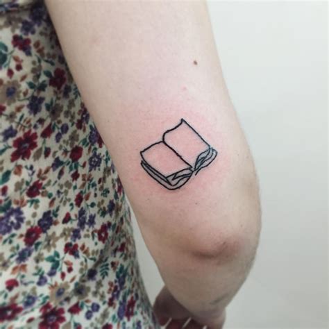 Open book tattoo by Suki Lune - Tattoogrid.net