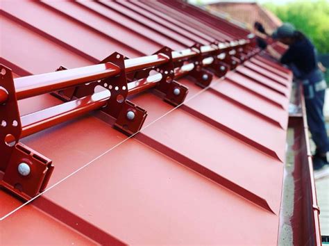 Snow guards for standing seam metal roofs - Metal Roof Experts in ...