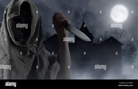 Scary bizarre man holding knife hi-res stock photography and images - Alamy