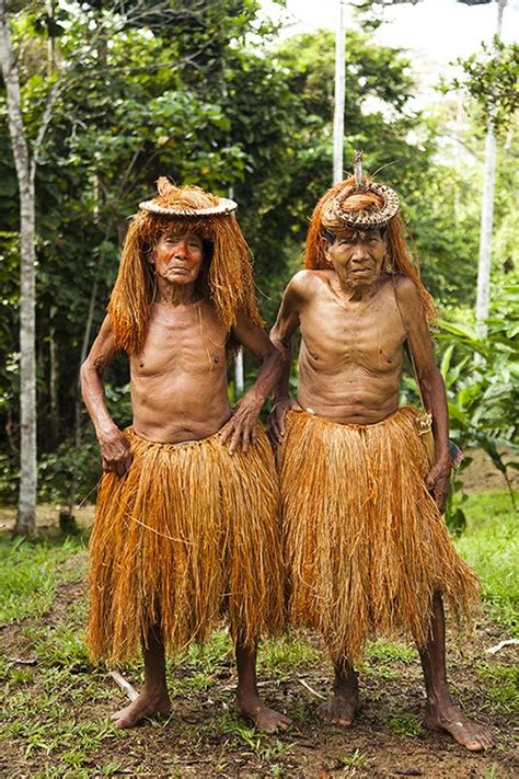 Elders from the Yagua tribe in traditional dress. The Amazon jungle of ...