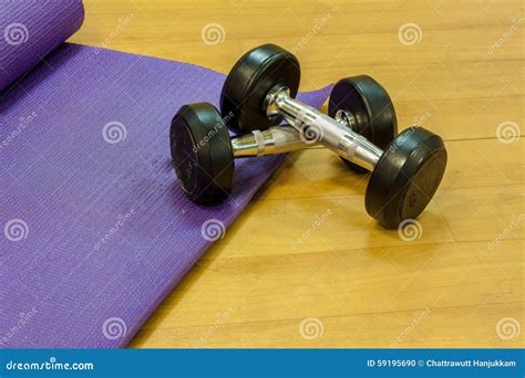 Fitness Equipment Dumbbells,yoga Mat, on Wood Background. Stock Photo ...